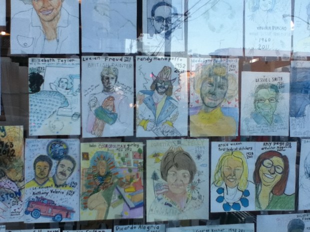 the obituaries window at dog-eared books